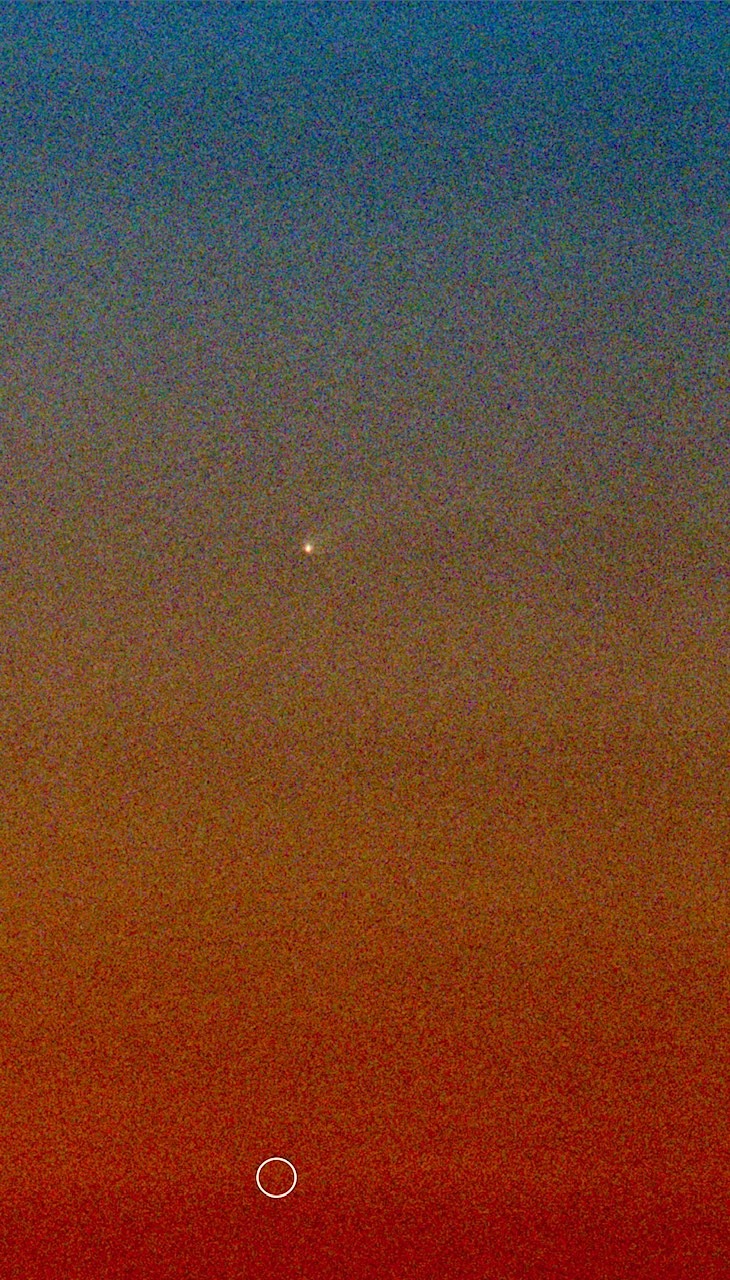 Comet C/2023 A3 Tsushinshan-ATLAS low in the east.